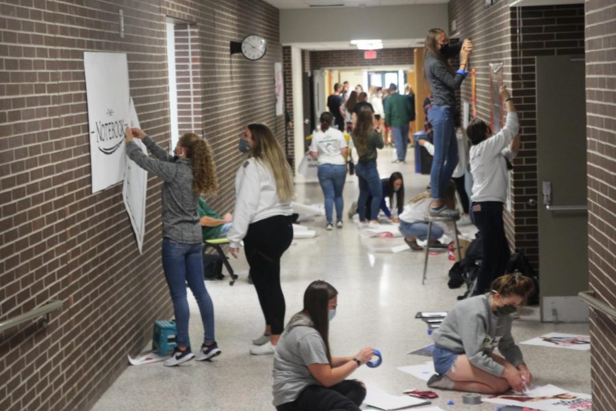 Juniors decorate their homecoming hall their theme is romance.