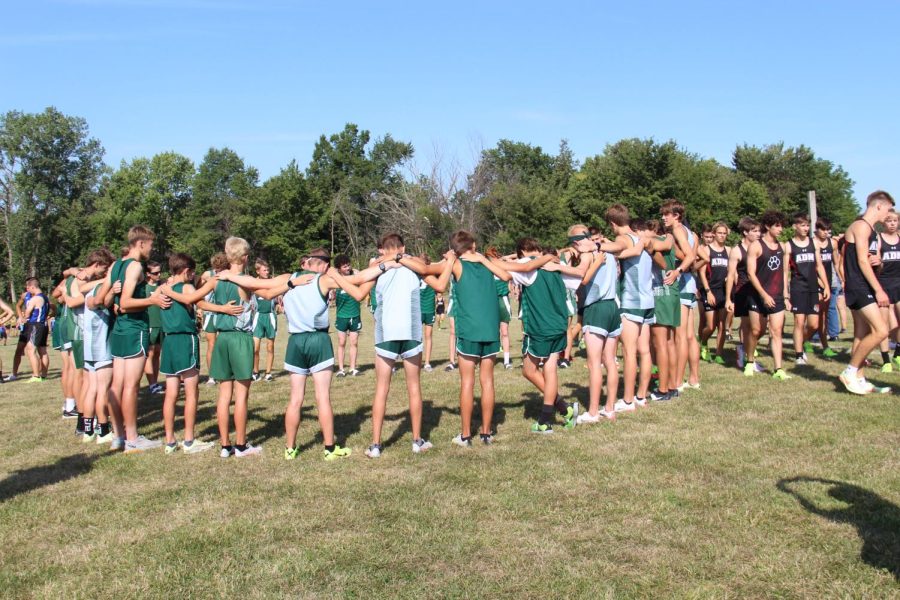 Runners pray before the race.