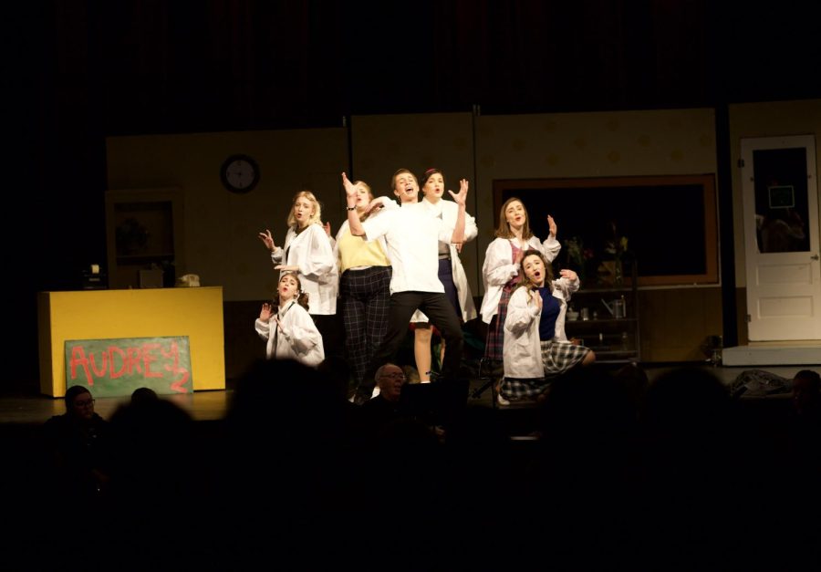 The Dentist, played by Grant Anderson and The Urchins played by Aleigha Ausman, Braelyn Ensor, Lucille Hopkins, Tatum Carlstone, Josephine McDonald and Bethany Schreur all sing in the song Dentist! and hit this ending pose.