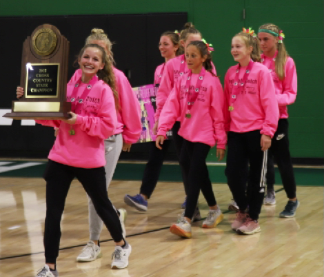 Girls Cross Country celebrates winning state.