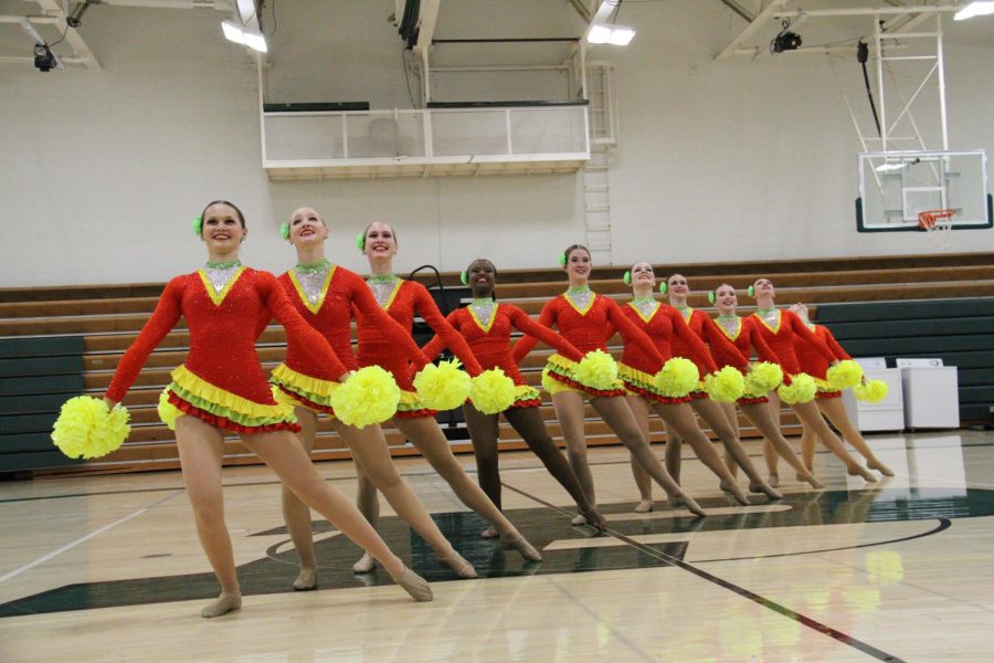 The+Forte+team+performs+their+Pom+routine+with+their+brand-new+costumes.