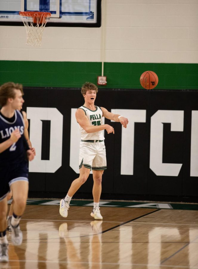 Senior Cam Schulte makes a hard pass up the court.
