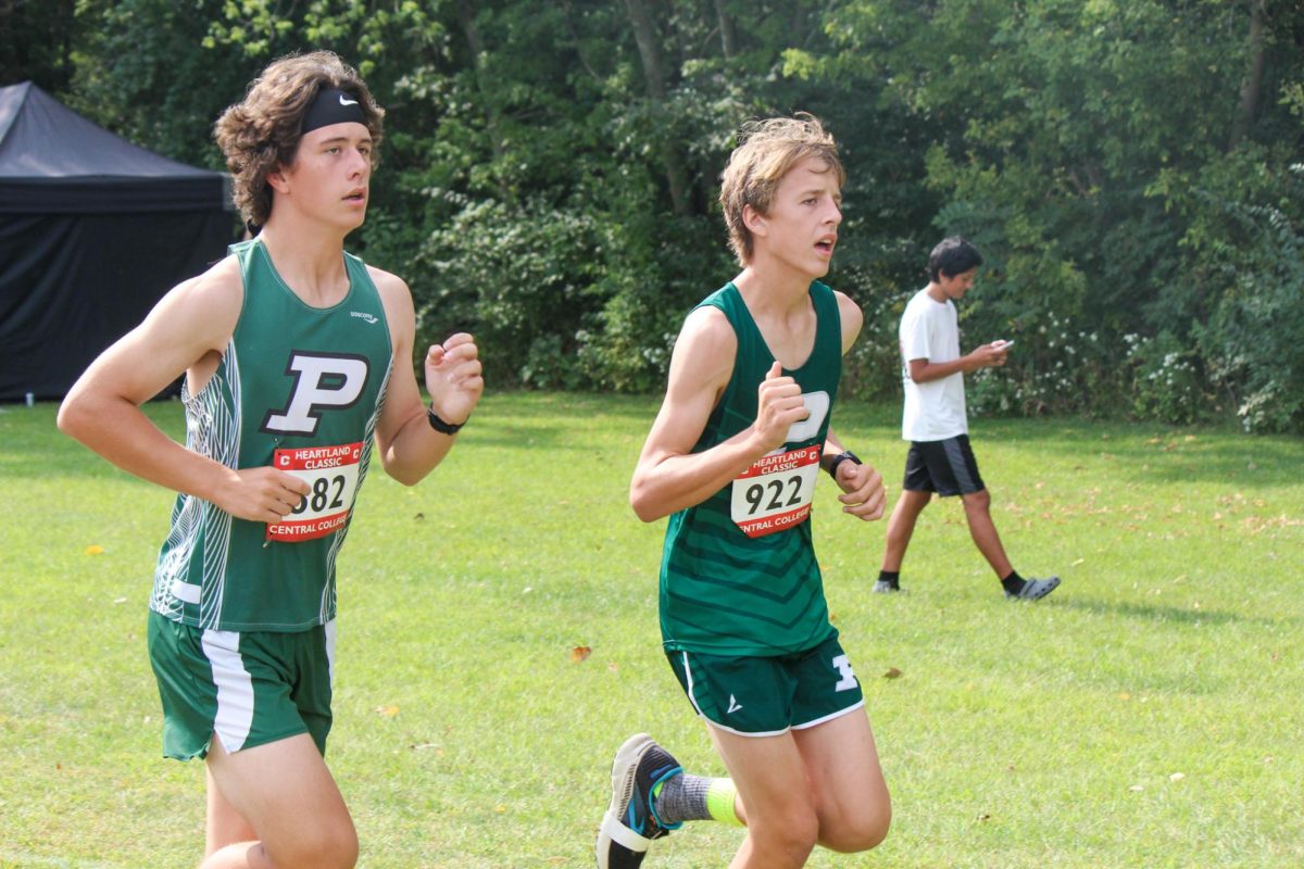 Jack Brown and Isaac Vandenberg run together at the Central Course 