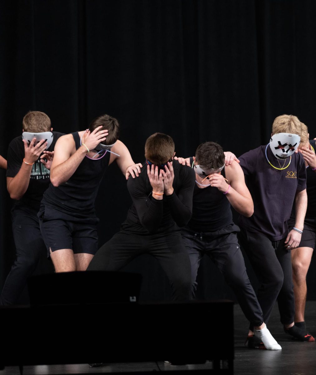 The Juniors wear masks during part of their lip sync.