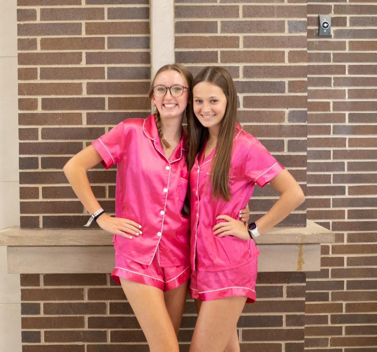 Seniors Mallory Westerkamp and Stella Stelpflug wear their pink pajamas for homecoming.
