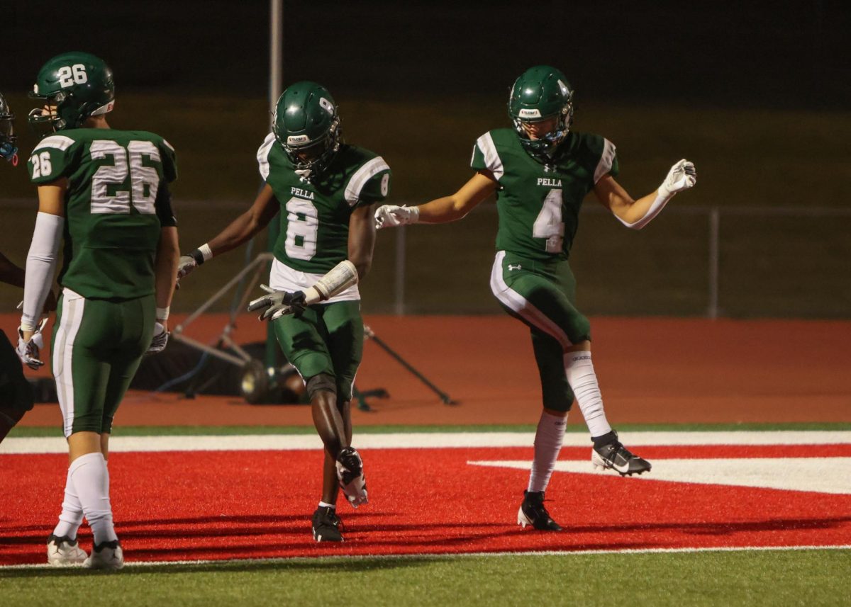 Juniors Harrison Mullens and Rex Rhamy celebrate a touchdown securing the win over Gilbert at home. Pella Dutch beat Gilbert 28-14 after a perfect pass from quarterback Senior Colin Kernt to Mullens for a put away touchdown. "It was perfect, from the throw to the fire celebration after," said Mullens.