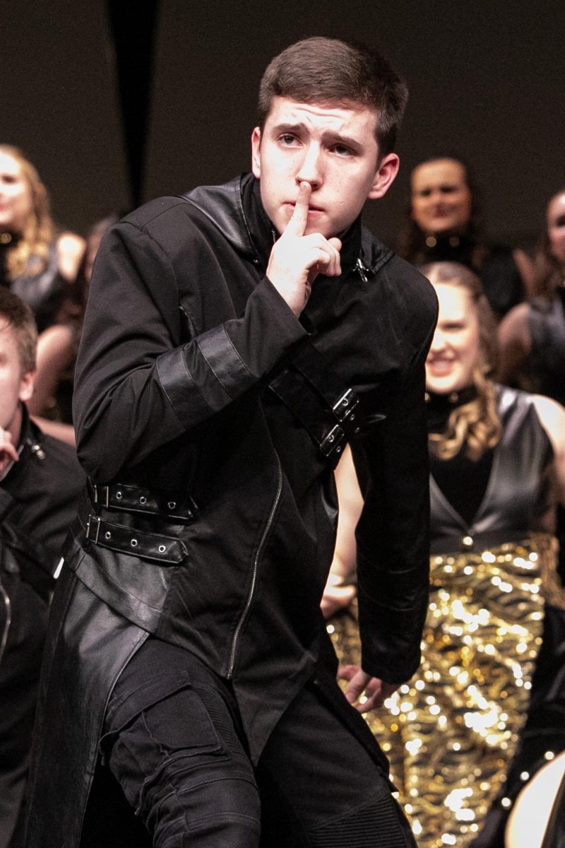 Junior Eric Buckingham performs for AcaPella at the Show Choir Parent Preview. AcaPella would then go on to place third and second overall at Benton and Muscatine. 