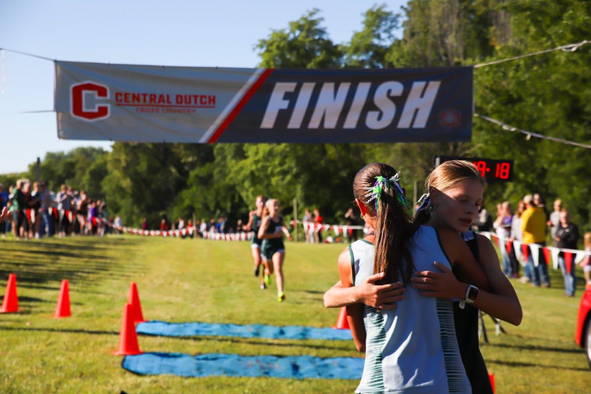 Senior Marissa Ferebee and freshman Lizzy VandeVoort run at Central College for Pella's invitational. "The opening was a great experience because we were starting once again," said Ferebee. "It was one of our first runs this year, so I felt good going back out there."